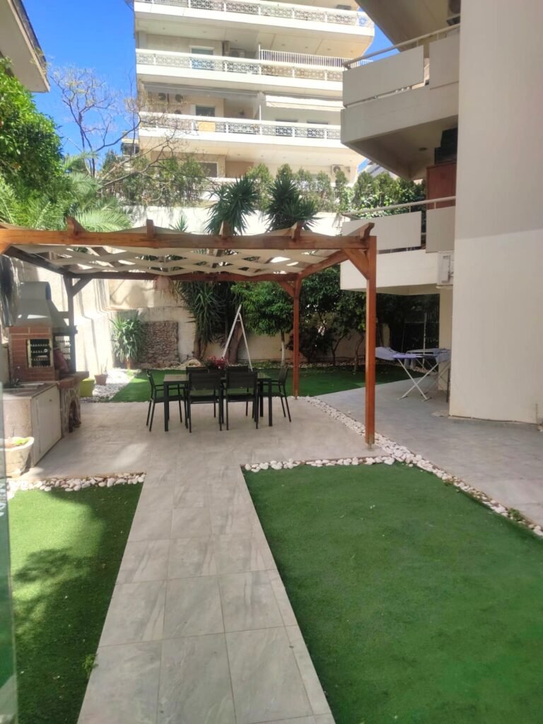 Prime Coastal Investment: Fully Renovated Sea-View Apartment with Private Garden in Paleo Faliro · VelaProperty